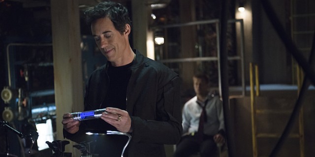 The Flash -- "Grodd Lives" -- Image FLA121B_0235b -- Pictured (L-R): Tom Cavanagh as Harrison Wells and Rick Cosnett as Detective Eddie Thawne -- Photo: Cate Cameron/The CW -- ÃÂ© 2015 The CW Network, LLC. All rights reserved.